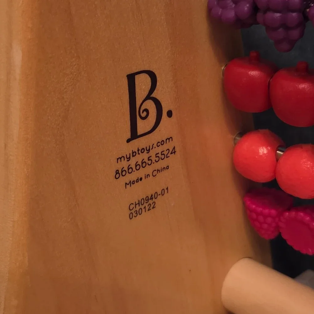B. Toys Two-Ty Fruity Wooden Abacus Toy Textured Fruit Counting Math Board